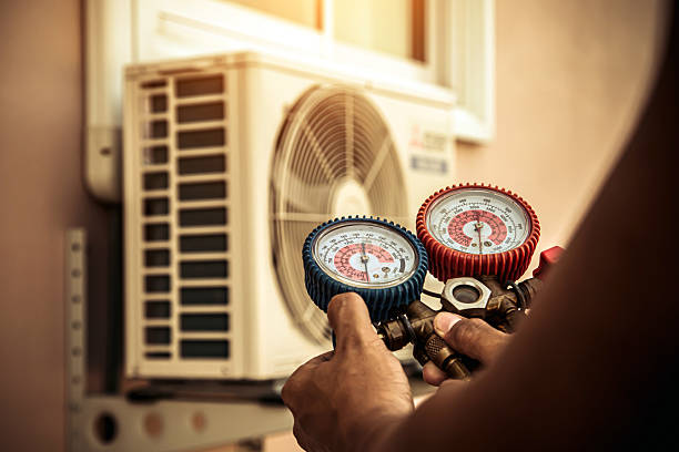 Professional Heat Pump Repair technician working in Raywick, KY